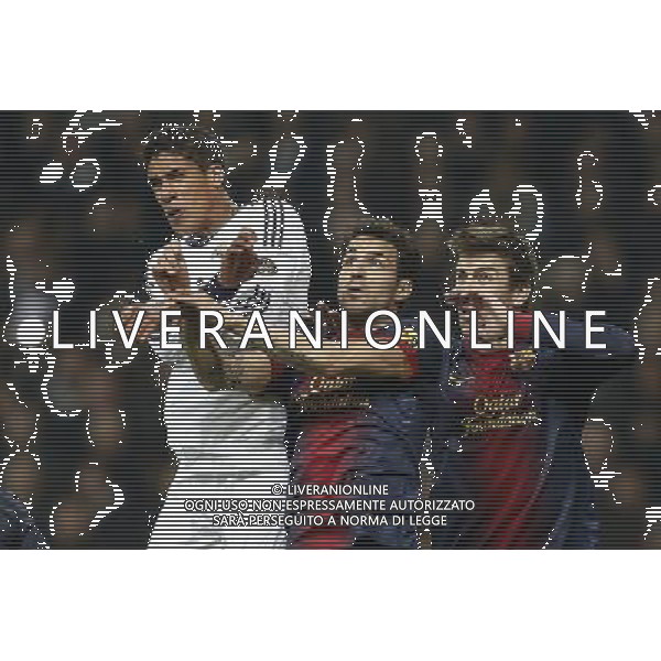 Real Madrid\'s Raphael Varane (goal) and FC Barcelona\'s Cesc Fabregas and Gerard Pique during spanish Kings Cup match on January 30th 2013. Photo: Cid-Fuentes Cebolla / ALFAQUI AG ALDO LIVERANI S A S ONLY ITALY
