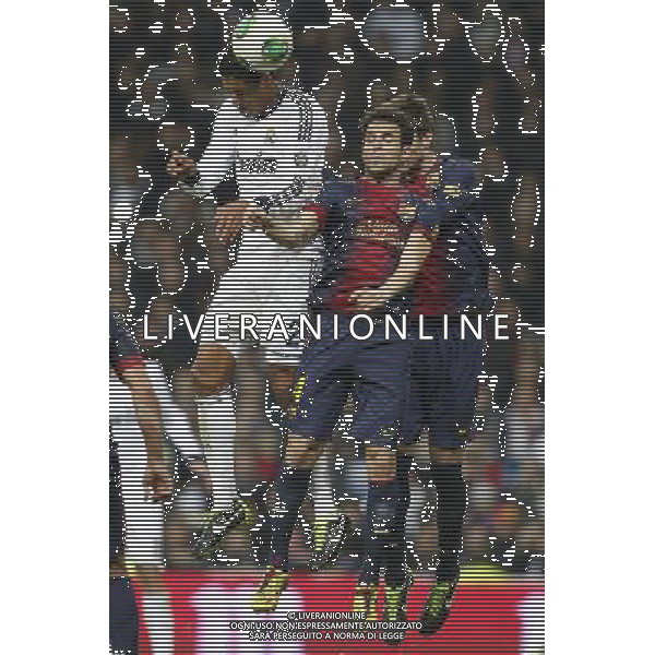 Real Madrid\'s Raphael Varane (goal) and FC Barcelona\'s Cesc Fabregas and Gerard Pique during spanish Kings Cup match on January 30th 2013. Photo: Cid-Fuentes Cebolla / ALFAQUI AG ALDO LIVERANI S A S ONLY ITALY