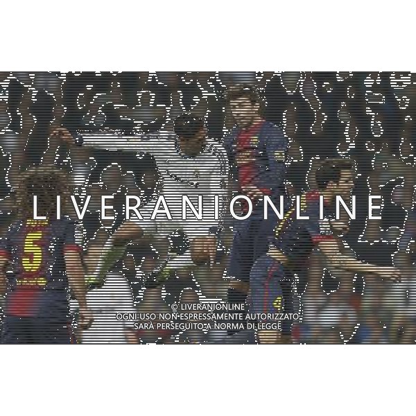 Real Madrid\'s Raphael Varane (goal) and FC Barcelona\'s Cesc Fabregas and Gerard Pique during spanish Kings Cup match on January 30th 2013. Photo: Cid-Fuentes Cebolla / ALFAQUI AG ALDO LIVERANI S A S ONLY ITALY