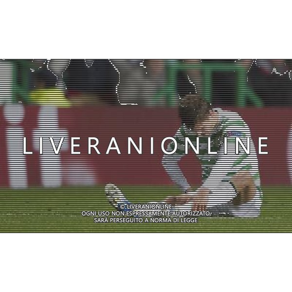 12/02/13 UEFA CHAMPIONS LEAGUE CELTIC v JUVENTUS CELTIC PARK - GLASGOW Dejection for Celtic defender Mikael Lustig after picking up a knock ©/AGENZIA ALDO LIVERANI SAS - ITALY ONLY - EDITORIAL USE ONLY