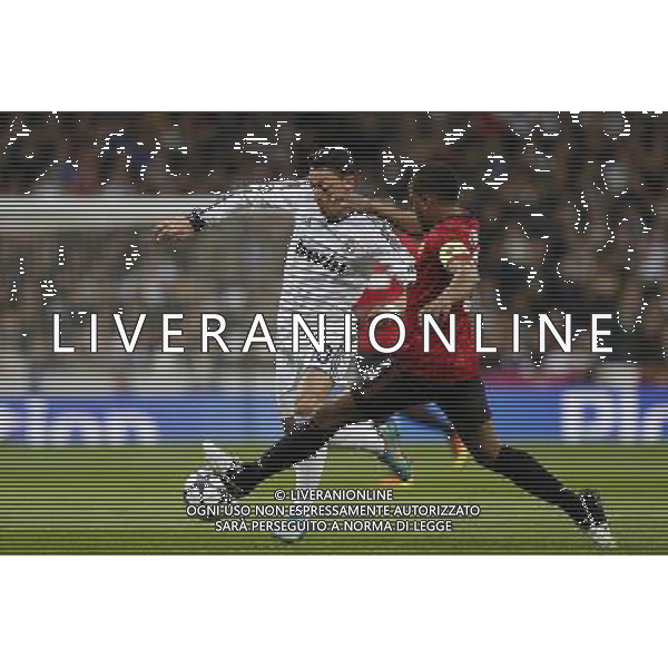 Real Madrid\'s Mesut Ozil and Manchester United\'s Patrice Evra during Champions League match on february 13th 2013. Photo: Cid-Fuentes Cebolla / ALFAQUI /AGENZIA ALDO LIVERANI SAS - ITALY ONLY - EDITORIAL USE ONLY