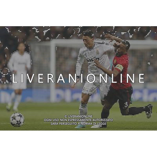Real Madrid\'s Mesut Ozil and Manchester United\'s Patrice Evra during Champions League match on february 13th 2013. Photo: Cid-Fuentes Cebolla / ALFAQUI /AGENZIA ALDO LIVERANI SAS - ITALY ONLY - EDITORIAL USE ONLY
