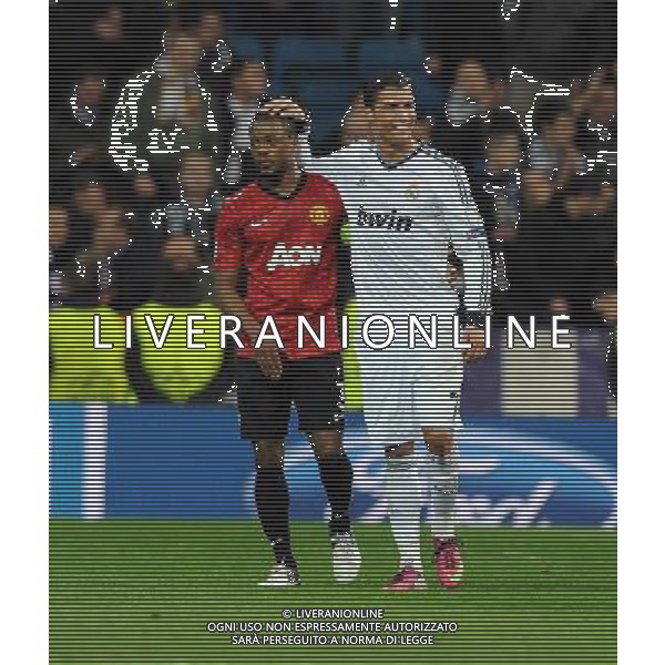 Cristiano Ronaldo and Manchester United Patrice Evra after the final whistle Real Madrid 2012/13 Real Madrid Vs Manchester United (1-1) 13/02/13 The Champions League Photo: Robin Parker Fotosports International ©Photoshot/AGENZIA ALDO LIVERANI SAS-ITALY ONLY - EDITORIAL USE ONLY