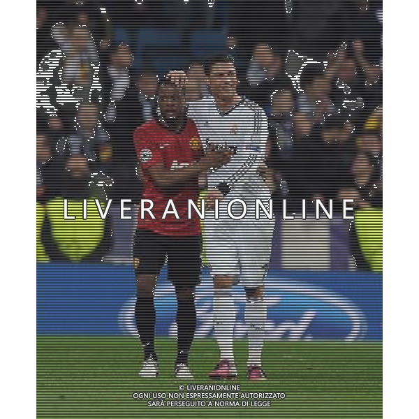 Cristiano Ronaldo and Manchester United Patrice Evra after the final whistle Real Madrid 2012/13 Real Madrid Vs Manchester United (1-1) 13/02/13 The Champions League Photo: Robin Parker Fotosports International ©Photoshot/AGENZIA ALDO LIVERANI SAS-ITALY ONLY - EDITORIAL USE ONLY