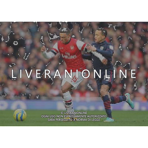 Arsenal\'s Alex Oxlade-Chamberlain shields the ball from Blackburn Rovers\' Marcus Olsson - Credit - CameraSport - Karyn Haddon - Football - FA Challenge Cup Fifth Round - Arsenal v Blackburn Rovers - Saturday 16th February 2013 - Emirates stadium - London © CameraSport - 43 Linden Ave. Countesthorpe. Leicester. England. LE8 5PG - Tel: +44 (0) 116 277 4147 - admin@camerasport.com - www.camerasport.com AG ALDO LIVERANI S A S ONLY ITALY