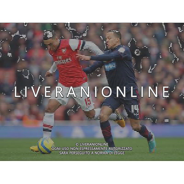 Arsenal\'s Alex Oxlade-Chamberlain shields the ball from Blackburn Rovers\' Marcus Olsson - Credit - CameraSport - Karyn Haddon - Football - FA Challenge Cup Fifth Round - Arsenal v Blackburn Rovers - Saturday 16th February 2013 - Emirates stadium - London © CameraSport - 43 Linden Ave. Countesthorpe. Leicester. England. LE8 5PG - Tel: +44 (0) 116 277 4147 - admin@camerasport.com - www.camerasport.com AG ALDO LIVERANI S A S ONLY ITALY