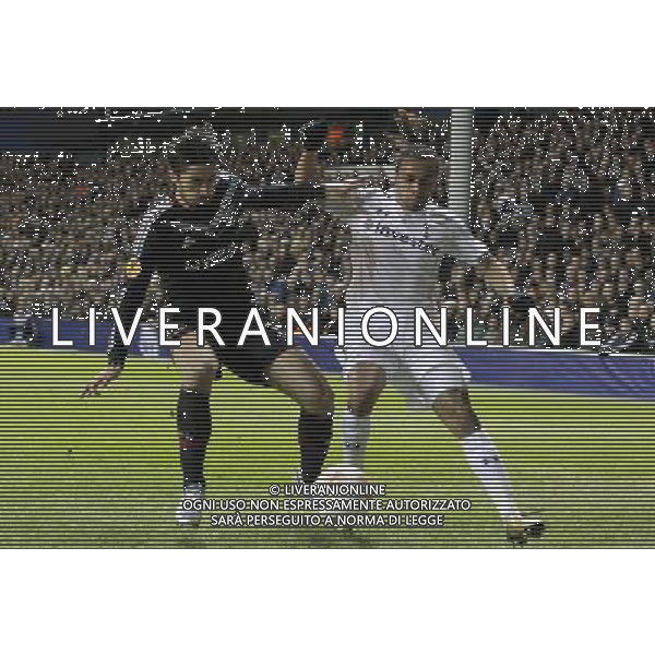 Olympique Lyonnais Milan Bisevac battles with Tottenham Hotspur\'s Benoit Assou-Ekotto. Spurs Beat Lyon 2:1 Tottenham Hotspur 14/02/13 Tottenham Hotspur V Olympique Lyonnais 14/02/13 UEFA Europa League Photo: Richard Washbrooke Fotosports International AG ALDO LIVERANI S A S ONLY ITALY