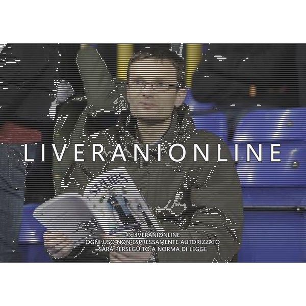 Spurs fans read their programs prior to the game. Spurs beat Lyon 2:1 Tottenham Hotspur 14/02/13 Tottenham Hotspur V Olympique Lyonnais 14/02/13 UEFA Europa League Photo: Richard Washbrooke Fotosports International AG ALDO LIVERANI S A S ONLY ITALY