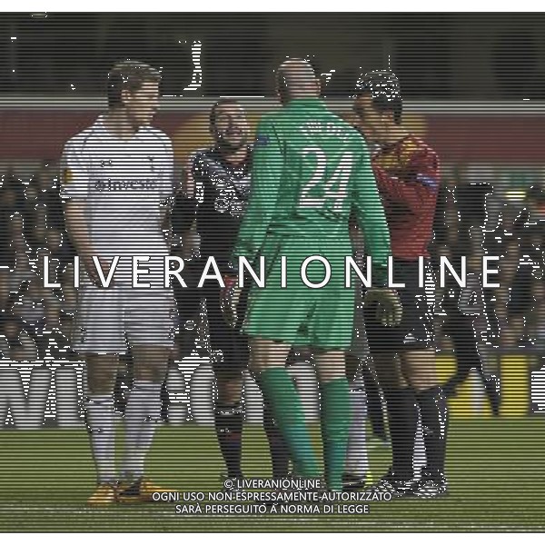 Referee Pedro Proenca De Oliveira Al keeps the peace after Tottenham Hotspur\'s Brad Friedel argues with Olympique Lyonnais Lisandro. Spurs beat Lyon 2:1 Tottenham Hotspur 14/02/13 Tottenham Hotspur V Olympique Lyonnais 14/02/13 UEFA Europa League Photo: Richard Washbrooke Fotosports International AG ALDO LIVERANI S A S ONLY ITALY