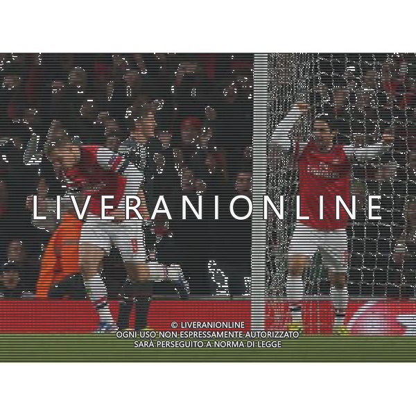 LUKAS PODOLSKI CELEBRATES HIS GOAL \' MIKEL ARTETA ARSENAL V BAYERN MUNICH ARSENAL V BAYERN MUNICH. UEFA CHAMPIONS LEAGUE EMIRATES STADIUM, LONDON, ENGLAND, UK 19 February 2013 GAQ65993 WARNING! This Photograph May Only Be Used For Newspaper And/Or Magazine Editorial Purposes. May Not Be Used For Publications Involving 1 player, 1 Club Or 1 Competition Without Written Authorisation From Football DataCo Ltd. For Any Queries, Please Contact Football DataCo Ltd on +44 (0) 207 864 9121 AG ALDO LIVERANI S A S ONLY ITALY