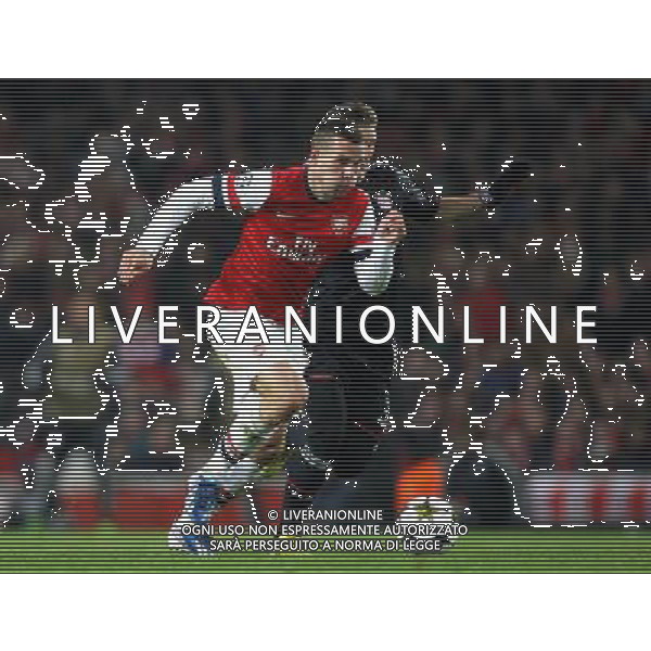 Arsenal\'s Lukas Podolski shields the ball from Bayern Munich\'s Bastian Schweinsteiger - Credit - CameraSport - KARYN HADDON - Football - UEFA Champions League Round of 16 First Leg - Arsenal v Bayern Munich - Tuesday 19th February 2013 - Emirates Stadium - London © CameraSport - 43 Linden Ave. Countesthorpe. Leicester. England. LE8 5PG - Tel: +44 (0) 116 277 4147 - admin@camerasport.com - www.camerasport.com AG ALDO LIVERANI S A S ONLY ITALY