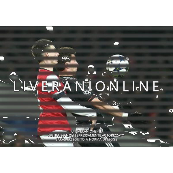 Arsenal\'s Laurent Koscielny and Bayern Munich\'s Mario Mandzukic Football - UEFA Champions League - round of 16 - First Leg - Arsenal London v Bayern Munich - 19th February 2013 - Emirates Stadium - London - UK Foto: Michal Zemanek / dla Newspix.pl LIGA MISTRZOW SEZON 2012/2013 PILKA NOZNA ARSENAL LONDYN vs BAYERN MONACHIUM --- Newspix.pl AG ALDO LIVERANI S A S ONLY ITALY *** Local Caption *** www.newspix.pl mail us: info@newspix.pl call us: 0048 022 23 22 222 --- Polish Picture Agency by Ringier Axel Springer Poland