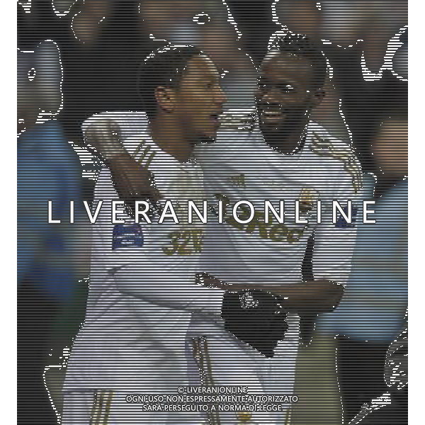 Wembley Stadium Bradford City v Swansea City (0-5) Capital One Cup Final 24/02/2013 Jonathan de Guzman (Swansea) celebrates with Roland Lamah after scoring fifth goal from the Penalty sport to score fourth goal Photo: Roger Parker Fotosports International ©PHOTOSHOT/AGENZIA ALDO LIVERANI SAS - ITALY ONLY - EDITORIAL USE ONLY