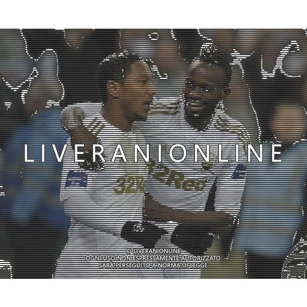 Wembley Stadium Bradford City v Swansea City (0-5) Capital One Cup Final 24/02/2013 Jonathan de Guzman (Swansea) celebrates with Roland Lamah after scoring fifth goal from the Penalty sport to score fourth goal Photo: Roger Parker Fotosports International ©PHOTOSHOT/AGENZIA ALDO LIVERANI SAS - ITALY ONLY - EDITORIAL USE ONLY