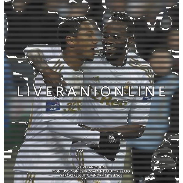 Wembley Stadium Bradford City v Swansea City (0-5) Capital One Cup Final 24/02/2013 Jonathan de Guzman (Swansea) celebrates with Roland Lamah after scoring fifth goal from the Penalty sport to score fourth goal Photo: Roger Parker Fotosports International ©PHOTOSHOT/AGENZIA ALDO LIVERANI SAS - ITALY ONLY - EDITORIAL USE ONLY