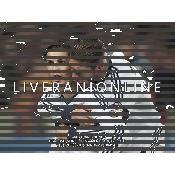 (130227) -- BARCELONA , Feb. 27, 2013 () -- Cristiano Ronaldo (L) of Real Madrid celebrates scoring with his teammate during the Spanish King\'s Cup semifinal second round match against Barcelona at Camp Nou stadium in Barcelona, on Feb. 26, 2013. Real Madrid won 3-1 and advanced to the final with 4-2 after two rounds. (/Xie Haining) ©photoshot/AGENZIA ALDO LIVERANI SAS - ITALY ONLY - Barcellona - Real Madrid partita semifinale secondo turno della Coppa del Re al Camp Nou di Barcellona, Spagnal 26 febbraio 2013. Il Real Madrid ha vinto 3-1