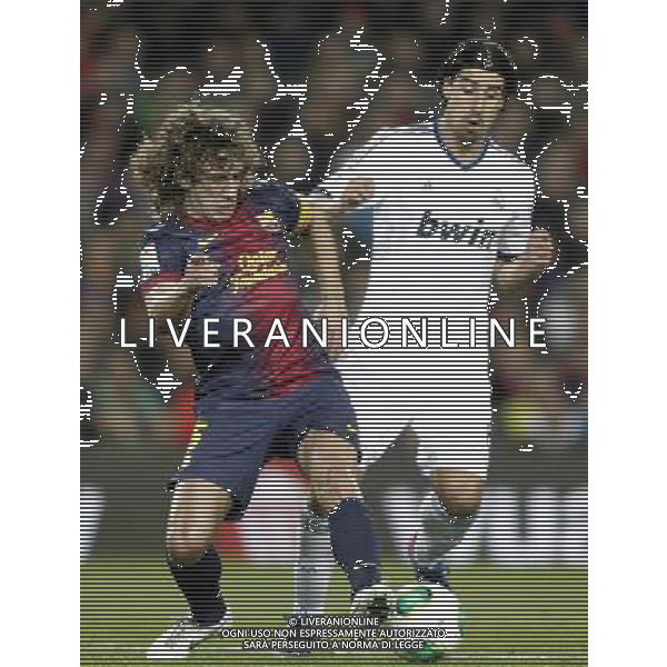 FC Barcelona\'s Carles Puyol (l) and Real Madrid\'s Sami Khedira during Copa del Rey - King\'s Cup semifinal second match.February 26,2013. (ALFAQUI/Acero) AG ALDO LVERANI S A S ONLY ITALY