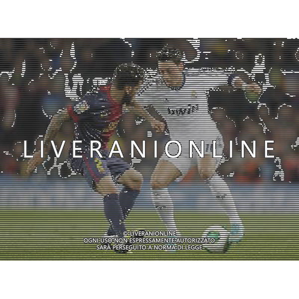 FC Barcelona\'s Daniel Alves (l) and Real Madrid\'s Mesut Ozil during Copa del Rey - King\'s Cup semifinal second match.February 26,2013. (ALFAQUI/Acero) AG ALDO LVERANI S A S ONLY ITALY