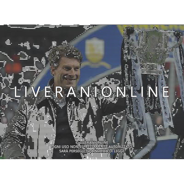 Swansea City\'s Manager Michael Laudrup celebrates with the Thorpy Football - Capital One Cup Final - Bradford City v Swansea City - Sunday 24th February 2013 - Wembley National Stadium - Wembley - London © CameraSport - 43 Linden Ave. Countesthorpe. Leicester. England. LE8 5PG - Tel: +44 (0) 116 277 4147 - admin@camerasport.com - www.camerasport.com ©photoshot/AGENZIA ALDO LIVERANI SAS - ITALY ONLY - EDITORIAL USE ONLY