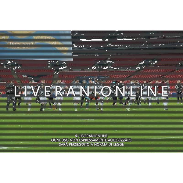 Swansea City players run and slide in celebration Football - Capital One Cup Final - Bradford City v Swansea City - Sunday 24th February 2013 - Wembley National Stadium - Wembley - London © CameraSport - 43 Linden Ave. Countesthorpe. Leicester. England. LE8 5PG - Tel: +44 (0) 116 277 4147 - admin@camerasport.com - www.camerasport.com ©photoshot/AGENZIA ALDO LIVERANI SAS - ITALY ONLY - EDITORIAL USE ONLY