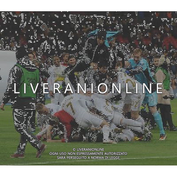 Swansea City players celebrate winning the CapitalOne League cup by having a pile on Football - Capital One Cup Final - Bradford City v Swansea City - Sunday 24th February 2013 - Wembley National Stadium - Wembley - London © CameraSport - 43 Linden Ave. Countesthorpe. Leicester. England. LE8 5PG - Tel: +44 (0) 116 277 4147 - admin@camerasport.com - www.camerasport.com ©photoshot/AGENZIA ALDO LIVERANI SAS - ITALY ONLY - EDITORIAL USE ONLY