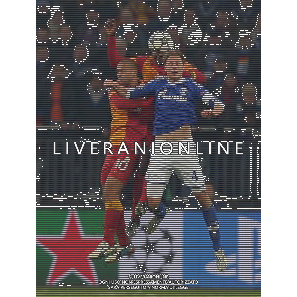 UEFA Champions League second match between Schalke 04 and Galatasaray at Veltins arena in Gelsenkirchen, Germany 12.03.2013 Match Scored: Schalke 04 (2) - Galatasaray (3) Pictured: Felipe Melo and Emmanuel Eboue of Galatasaray and Benedikt Hšwedes of Schalke 04. ©PHOTOSHOT/AGENZIA ALDO LIVERANI SAS - ITALY ONLY - EDITORIAL USE ONLY