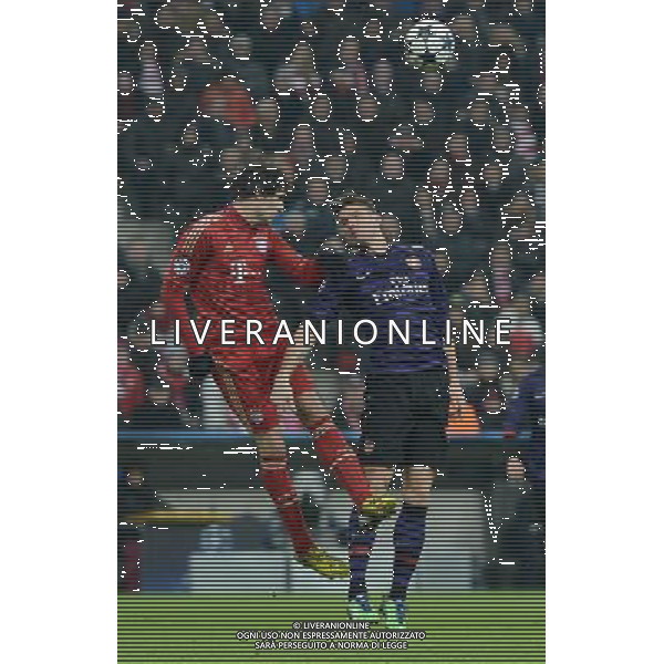 (130314) -- MUNICH, March 14, 2013 () -- Javi Martinez (L) of FC Bayern Munich vies with Olivier Giroud of Arsenal FC during the UEFA Champions League eighth-final match at Allianz Arena in Munich, south Germany, March 13, 2013. Bayern Munich lost 0-2 but entered the quarterfinal. (/Ma Ning) (ql) ©photoshot /AGENZIA ALDO LIVERANI SAS - ITALY ONLY - BAYERN MONACO FC-ARSENAL FC UEFA Champions League ritorno ottavi di finale a Allianz Arena a Monaco di Baviera, sud della Germania, 13 marzo 2013.