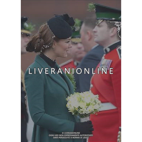 The Duke and Duchess of Cambridge visit the 1st Battalion Irish Guards at the St Patrickês Day Parade at Mons Barracks, Aldershot, Hampshire, UK. The Duke of Cambridge attended the Parade as Colonel of the Regiment. Her Royal Highness presented the traditional sprigs of shamrocks to the Officers and Guardsmen of the Regiment. 17-3-2013 ©photoshot/AGENZIA ALDO LIVERANI SAS - ITALY ONLY - REALI INGLESI: Il principe William d\'inghilterra con la moglie kate middleton in visita al 1mo battaglione delle Guardie irlandesi alla parata nel giorno di san patrizio, Hampshire, Regno Unito 17 marzo 2013 