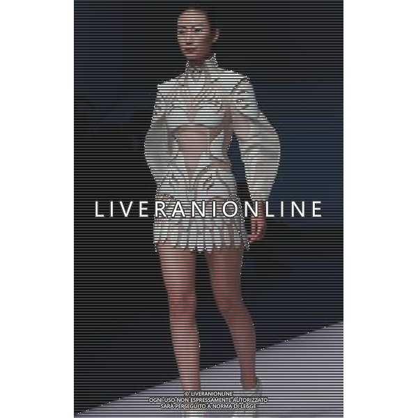 (130325) -- BEIJING, March 25, 2013 () -- A model presents a creation of designers attending the 21st China International Young Fashion Designers Contest in Beijing, capital of China, March 25, 2013. The contest theming Boundary has attracted 29 designers from 16 countries. (/Li Mingfang) (zc) ©Photoshot/AGENZIA ALDO LIVERANI SAS-ITALY ONLY - EDITORIAL USE ONLY