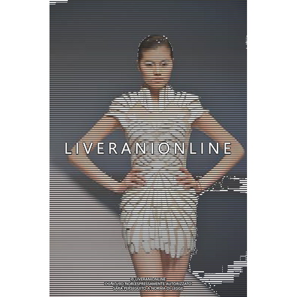 (130325) -- BEIJING, Mar. 25, 2013 () -- A model presents a creation of designers attending the 21st China International Young Fashion Designers Contest in Beijing, capital of China, March 25, 2013. The contest theming Boundary has attracted 29 designers from 16 countries. (/Li Xin) (cxy) ©Photoshot/AGENZIA ALDO LIVERANI SAS-ITALY ONLY - EDITORIAL USE ONLY