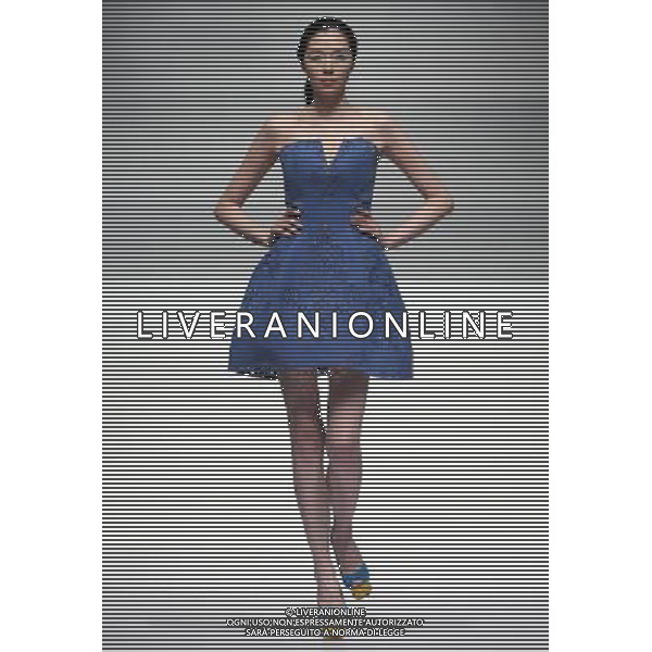 (130326) -- BEIJING, March 26, 2013 () -- A model presents a creation by designer Liu Wei during the opening ceremony of the China Fashion Week in Beijing, capital of China, March 25, 2013. (/Chen Jianli) (whj) ©Photoshot/AGENZIA ALDO LIVERANI SAS-ITALY ONLY - EDITORIAL USE ONLY