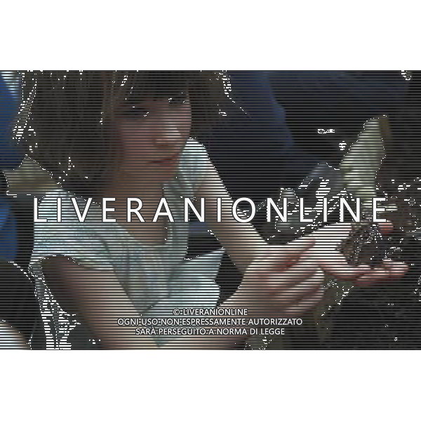 A butterfly lands on a girl hand in the \'Sensational Butterflies\' exhibition at the Natural History Museum on 25 March, 2013 in London, Britain. The live, tropical butterfly house will be stationed on the Natural History Museum\'s east lawn from March 29, 2013 until September 15, 2013. ©Photoshot/AGENZIA ALDO LIVERANI SAS-ITALY ONLY - EDITORIAL USE ONLY