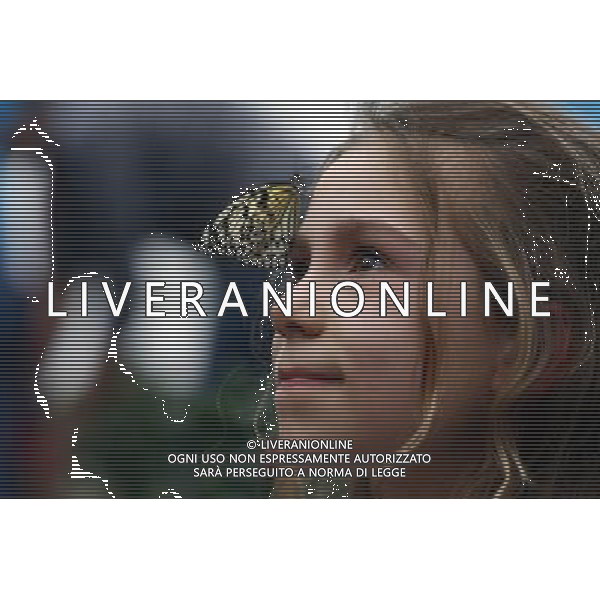 A butterfly lands on a girl face in the \'Sensational Butterflies\' exhibition at the Natural History Museum on 25 March, 2013 in London, Britain. The live, tropical butterfly house will be stationed on the Natural History Museum\'s east lawn from March 29, 2013 until September 15, 2013. ©Photoshot/AGENZIA ALDO LIVERANI SAS-ITALY ONLY - EDITORIAL USE ONLY