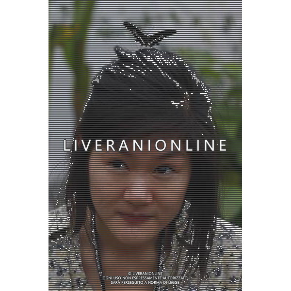 A butterfly lands on a woman in the \'Sensational Butterflies\' exhibition at the Natural History Museum on 25 March, 2013 in London, Britain. The live, tropical butterfly house will be stationed on the Natural History Museum\'s east lawn from March 29, 2013 until September 15, 2013. ©Photoshot/AGENZIA ALDO LIVERANI SAS-ITALY ONLY - EDITORIAL USE ONLY