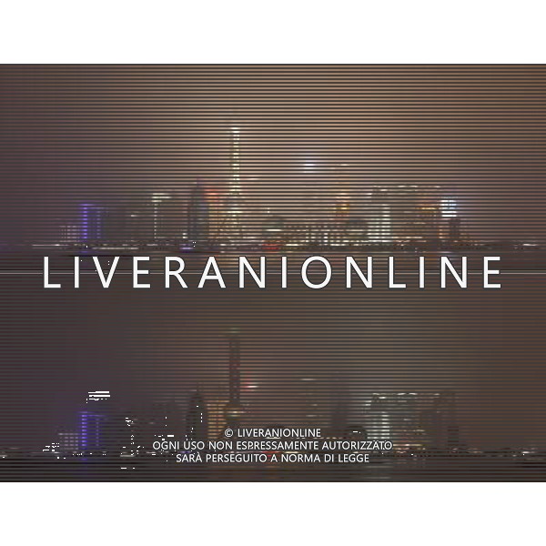 (130323) -- SHANGHAI, March 23, 2013 () -- The combo skyscrapers in the Lujiazui area of Shanghai, east China, before (up) and after turning off their lights to mark the annual \'Earth Hour\' event, March 23, 2013. (/Wei Song) (zn) ©Photoshot/AGENZIA ALDO LIVERANI SAS-ITALY ONLY - EDITORIAL USE ONLY