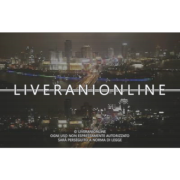 (130323) -- NINGBO, March 23, 2013 () -- The combo the downtown area of Ningbo City, east China\'s Zhejiang Province, before (up) and after turning off its lights to mark the annual \'Earth Hour\' event, March 23, 2013. (/Zhang Peijian) (zn) ©Photoshot/AGENZIA ALDO LIVERANI SAS-ITALY ONLY - EDITORIAL USE ONLY