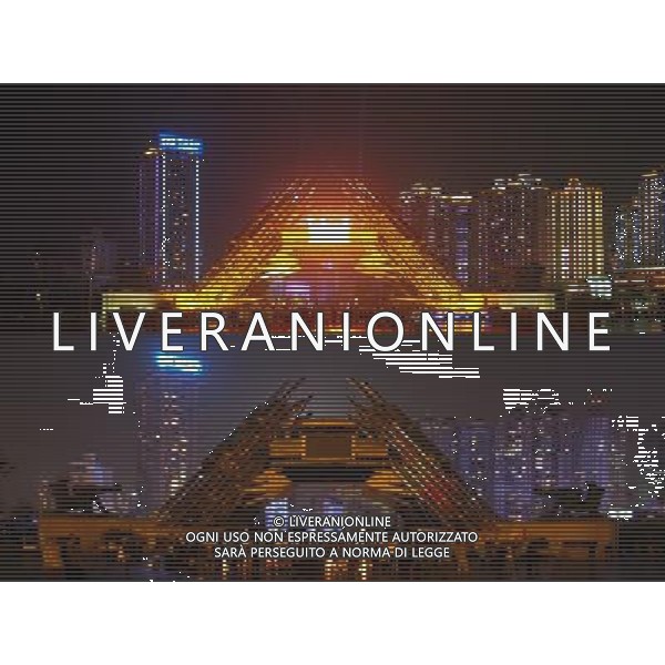 (130323) -- GUIYANG, March 23, 2013 () -- The combo the Golden Lusheng, a symbolic sculputure in Guiyang, capital of southwest China\'s Guizhou Province, before (up) and after turning off its lights to mark the annual \'Earth Hour\' event, March 23, 2013. (/Liu Xu) (zn) ©Photoshot/AGENZIA ALDO LIVERANI SAS-ITALY ONLY - EDITORIAL USE ONLY