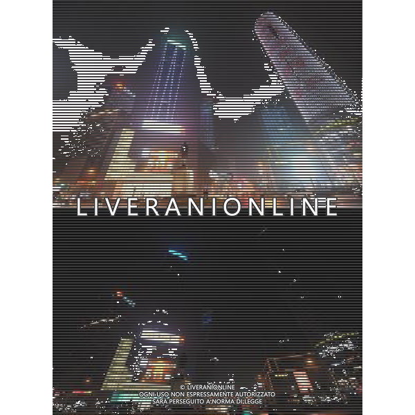 (130323) -- NANJING, March 23, 2013 () -- The combo skyscrapers in the Xinjiekou area of Nanjing, capital of east China\'s Jiangsu Province, before (up) and after turning off their lights to mark the annual \'Earth Hour\' event, March 23, 2013. (/Shen Peng) (zn) ©Photoshot/AGENZIA ALDO LIVERANI SAS-ITALY ONLY - EDITORIAL USE ONLY