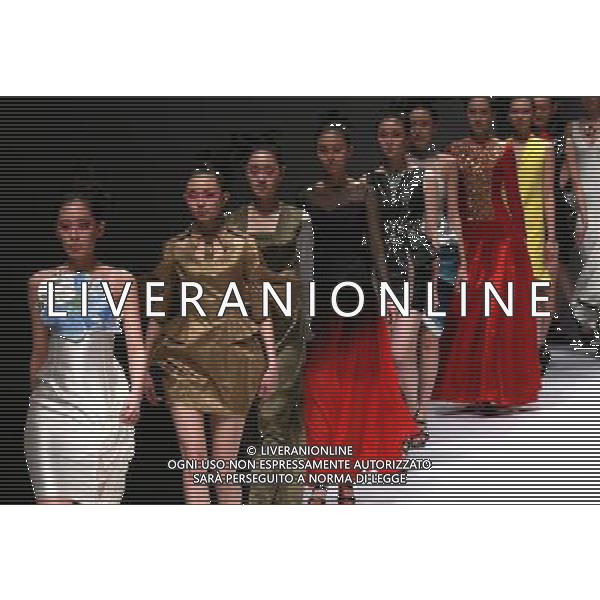 (130327) -- BEIJING, March 27, 2013 () -- Models present creations designed by students of Minzu University of China during the China Fashion Week in Beijing, capital of China, March 27, 2013. (/Li Mingfang) (ry) ©Photoshot/AGENZIA ALDO LIVERANI SAS-ITALY ONLY - EDITORIAL USE ONLY