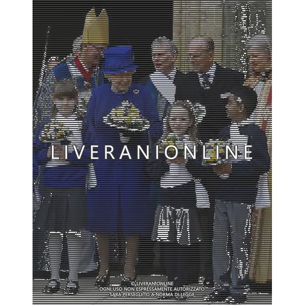 Britain\'s Queen Elizabeth II and The Duke of Edinburgh stand for a photograph after attending the Maundy service, at Christ Church Cathedral in Oxford, England, Thursday, March 28, 2013. During the service the Queen distributed the Maundy money to 87 women and 87 men, one for each of The QueenÍs 87 years. Each recipient receives two purses, one red and one white. The red purse will contain a 5 pound coin and 50 pence coin commemorating the 60th anniversary of The QueenÍs Coronation. The white purse will contain uniquely minted Maundy Money. This takes the form of silver one, two, three and four penny pieces, the sum of which equals the number of years the Monarch has years of age. This year there will be 87 pennies worth distributed. (AP Photo/Kirsty Wigglesworth, Pool) ©photoshot/AGENZIA ALDO LIVERANI SAS - ITALY ONLY - REALI INGLESI: La Regina ELISABETTA II, con il marito Filippo Duca di Edimburgo al Royal Service Santo alla Christ Church Cathedral poi su di un ricevimento presso il Decanato e poi pranzo come ospiti di Oriel College