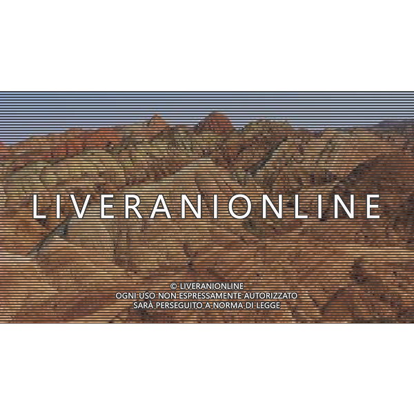 (130402) -- ZHANGYE, April 2, 2013 () -- Photo taken on April 1, 2013 shows a scenic view of Danxia Landform in Zhangye City, northwest China\'s Gansu Province. Danxia is a special landform from reddish sandstone that has been eroded over time into a series of mountains surrounded by curvaceous cliffs and many unusual rock formations. (/Shi Youdong) (hdt) ©photoshot/AGENZIA ALDO LIVERANI SAS - ITALY ONLY - Veduta panoramica dello scenario delle formazioni rocciose rossastre erose in modo molto particolari di Danxia a Zhangye City, nella provincia di Gansu nord-ovest della Cina