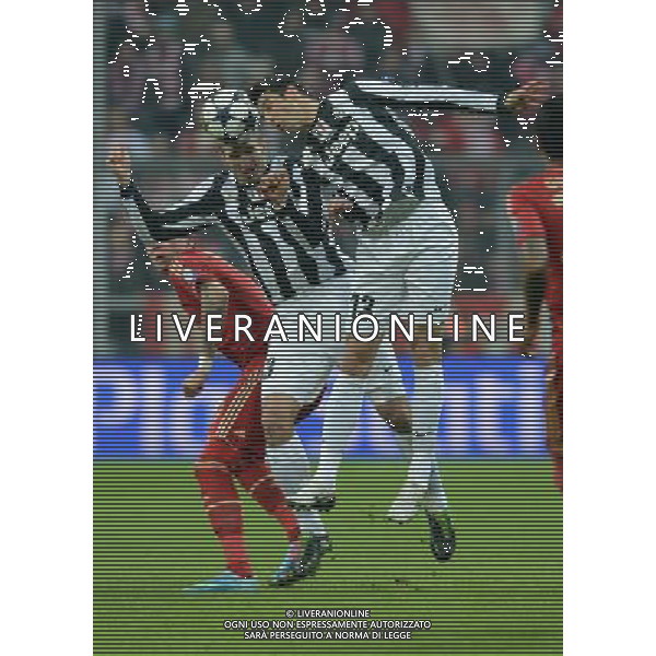 (130403) -- MUNICH, April 3, 2013 () -- Giorgio Chiellini (C) and Federico Peluso (R) of Juventus head the ball during the UEFA Champions League quarter-final match against Bayern Munich in Munich, south Germany, April 2, 2013. Bayern Munich won 2-0. (/Ma Ning) ©PHOTOSHOT/AGENZIA ALDO LIVERANI SAS - ITALY ONLY - Bayern Monaco - Juventus UEFA Champions League 2012/2013 Quarti di Finale andata Monaco di Baviera (Germania) - 02.04.2013