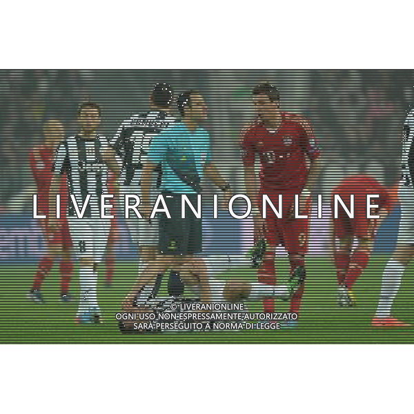 UEFA Champions League - Quarti di finale gara di ritorno Torino 10-04-2013 Juventus - Bayern Monaco nella foto Chiellini a terra dolorante dopo un contrasto con Mandzukic foto Roberto Garavaglia - ag. Aldo Liverani