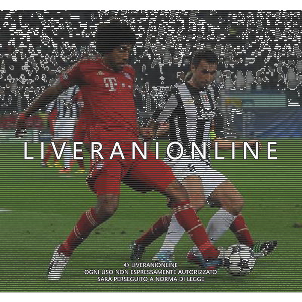 UEFA Champions League 2012/2013 Quarti di Finale Ritorno Torino - 10.04.2013 Juventus-Bayern Monaco Nella Foto:dante anticipa vucinic /Ph.Vitez-Ag. Aldo Liverani