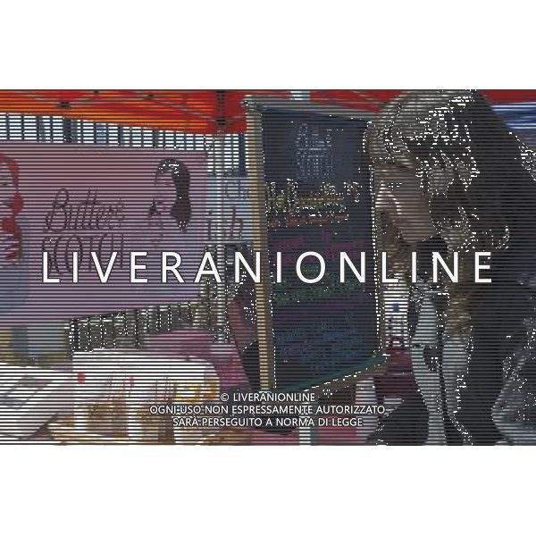 Foodies from around the city flock to opening day at the Smorgasburg in East River State Park in the Williamsburg neighborhood of Brooklyn in New York on Saturday, April 6, 2013. The marketplace features prepared and artisanal foods made in Brooklyn by small entrepreneurs. In the two years the market has been in operation it has provided a venue for numerous chefs and cooks to sell their wares, some of whom have grown into large successful businesses. (å Frances M. Roberts) ©photoshot/AGENZIA ALDO LIVERANI SAS - ITALY ONLY - La vita quotidiana della popolazione di Williamsburg, Brooklyn, New York 6 Aprile 2013.