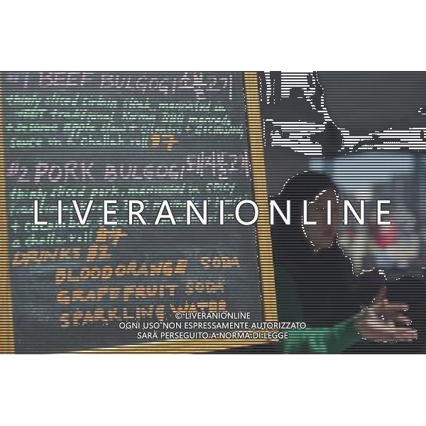 Foodies from around the city flock to opening day at the Smorgasburg in East River State Park in the Williamsburg neighborhood of Brooklyn in New York on Saturday, April 6, 2013. The marketplace features prepared and artisanal foods made in Brooklyn by small entrepreneurs. In the two years the market has been in operation it has provided a venue for numerous chefs and cooks to sell their wares, some of whom have grown into large successful businesses. (å Frances M. Roberts) ©photoshot/AGENZIA ALDO LIVERANI SAS - ITALY ONLY - La vita quotidiana della popolazione di Williamsburg, Brooklyn, New York 6 Aprile 2013.