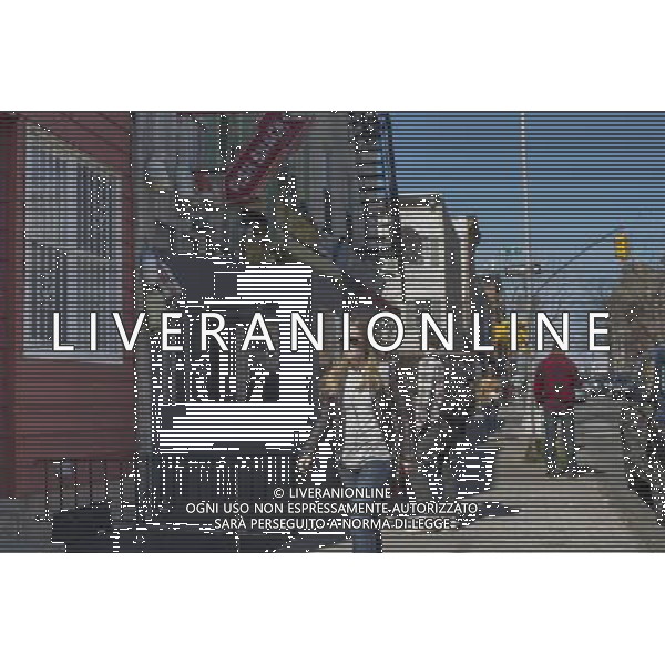 Street activity in the newly developed western edge of trendy hipster Williamsburg, Brooklyn in New York on Saturday, April 6, 2013. Changes in zoning allowed multi-story apartment buildings to be built in an area formerly zoned industrial causing a rapid increase in the population density. å (Frances M. Roberts) ©photoshot/AGENZIA ALDO LIVERANI SAS - ITALY ONLY - La vita quotidiana della popolazione di Williamsburg, Brooklyn, New York 6 Aprile 2013.