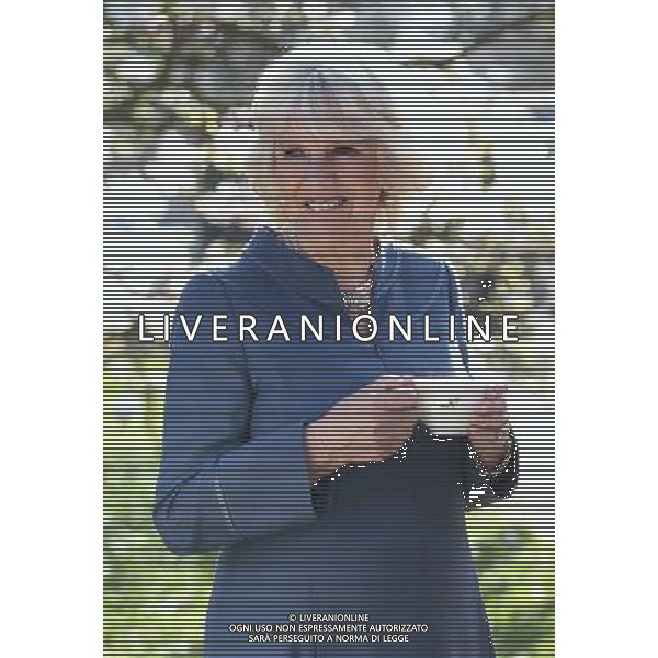 LONDON, ENGLAND - APRIL 23: Camilla, Duchess of Cornwall drinks a cup of tea in Clarence House garden as she hosts a tea party to celebrate the 5th Anniversary of the charity \'First Story\' on April 23, 2013 in London, England. First Story strives to support and inspire creativity in challenging UK secondary schools and their communities. The charity was launched in 2008 by former school teacher Katie Waldegrave. ©PHOTOSHOT/AGENZIA ALDO LIVERANI SAS - ITALY ONLY - REALI INGLESI: Camilla Duchessa di Cornovaglia, Patrono di The Big Lunch, ha presentato il grande pranzo Community Awards