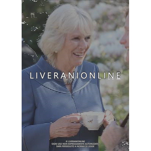 LONDON, ENGLAND - APRIL 23: Camilla, Duchess of Cornwall drinks a cup of tea in Clarence House garden as she hosts a tea party to celebrate the 5th Anniversary of the charity \'First Story\' on April 23, 2013 in London, England. First Story strives to support and inspire creativity in challenging UK secondary schools and their communities. The charity was launched in 2008 by former school teacher Katie Waldegrave. ©PHOTOSHOT/AGENZIA ALDO LIVERANI SAS - ITALY ONLY - REALI INGLESI: Camilla Duchessa di Cornovaglia, Patrono di The Big Lunch, ha presentato il grande pranzo Community Awards
