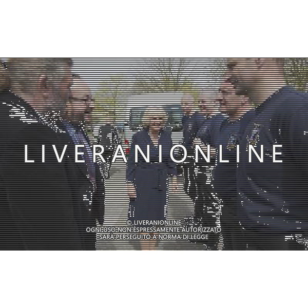 Camilla Duchess of Cornwall talks to members of her police outrider unit known as the \'Special Escort Group\' which is part of the metropolitan police. With her are the celebrity chefs known as the ñHairy Bikersî, Simon King and David Myers, who were with her on a visit to a Community Centre run by Elmbridge Borough Council in Cobham, Surrey. She also highlighted the the importance of the Elmbridge council\'s Meals on Wheels service. The \'Hairy biker\' chefs were there as part of their campaign to revive Meals on Wheels services for pensioners. The duchess also highligted the work being done by Surrey County Council in their Prevention Through Partnership Programme which arranges for services, like Meals on Wheels, to be made available to enable vulnerable people to live independently but with important support in their own homes. Pic: Richard Pohle ©PHOTOSHOT/AGENZIA ALDO LIVERANI SAS - ITALY ONLY - REALI INGLESI: Camilla Duchessa di Cornovaglia